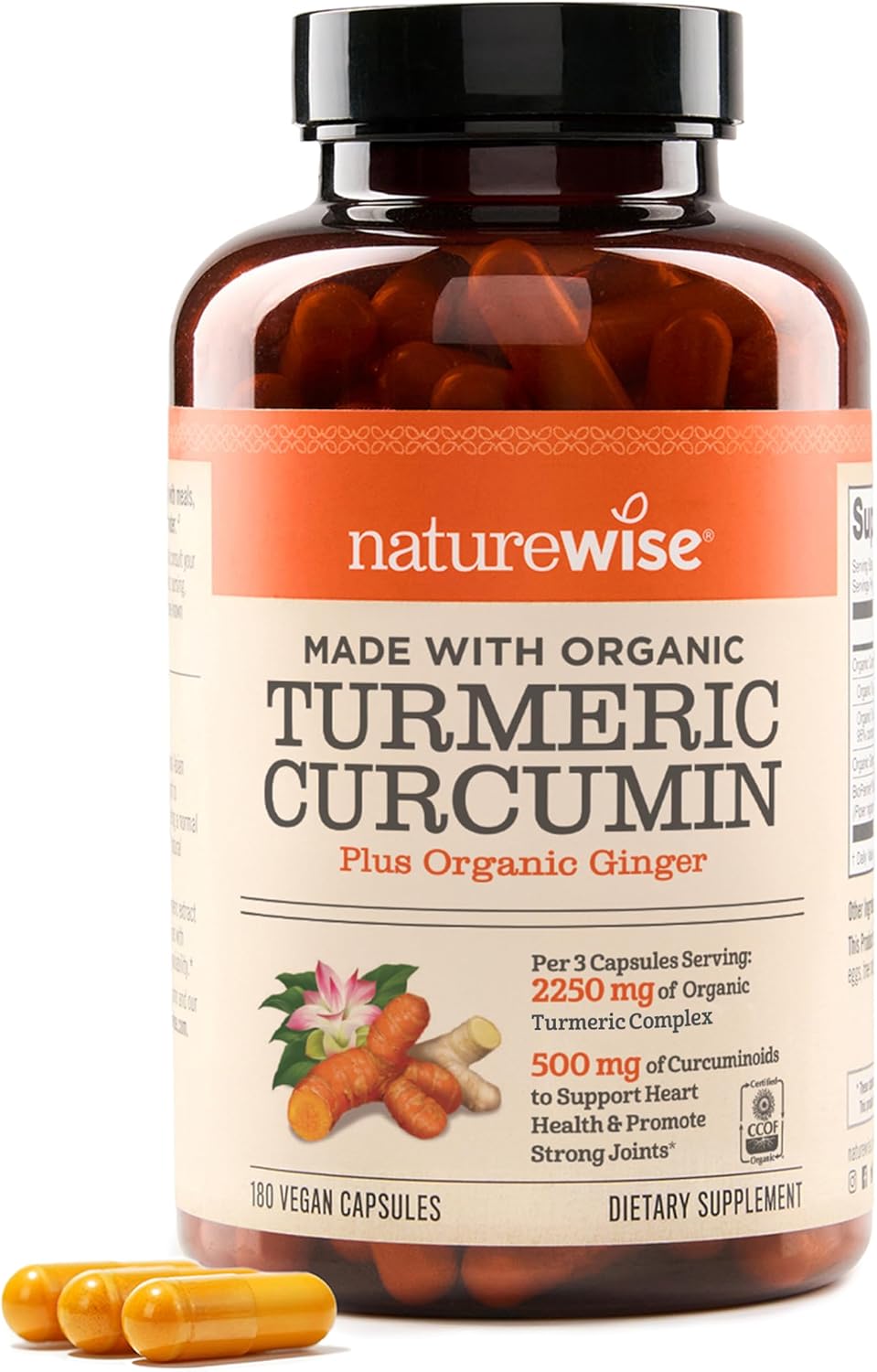 Elegantné balenie NatureWise Turmeric Curcumin 2250mg + BioPerine na drevenom stole s kurkumou a čiernym korením